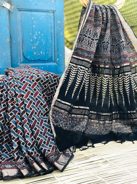 Pure Khadi Ajrakh Saree With Matt Rose Gold Border & Tassel.