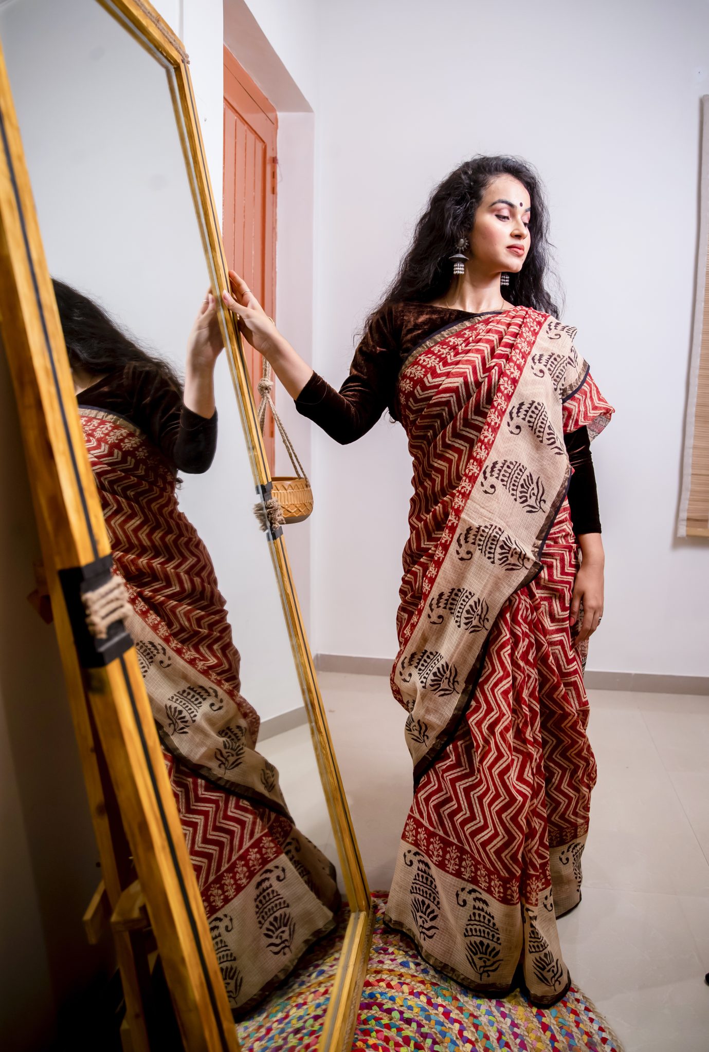 Maron and off white coloured hand block printed bagru pure kota doriya saree with zari border