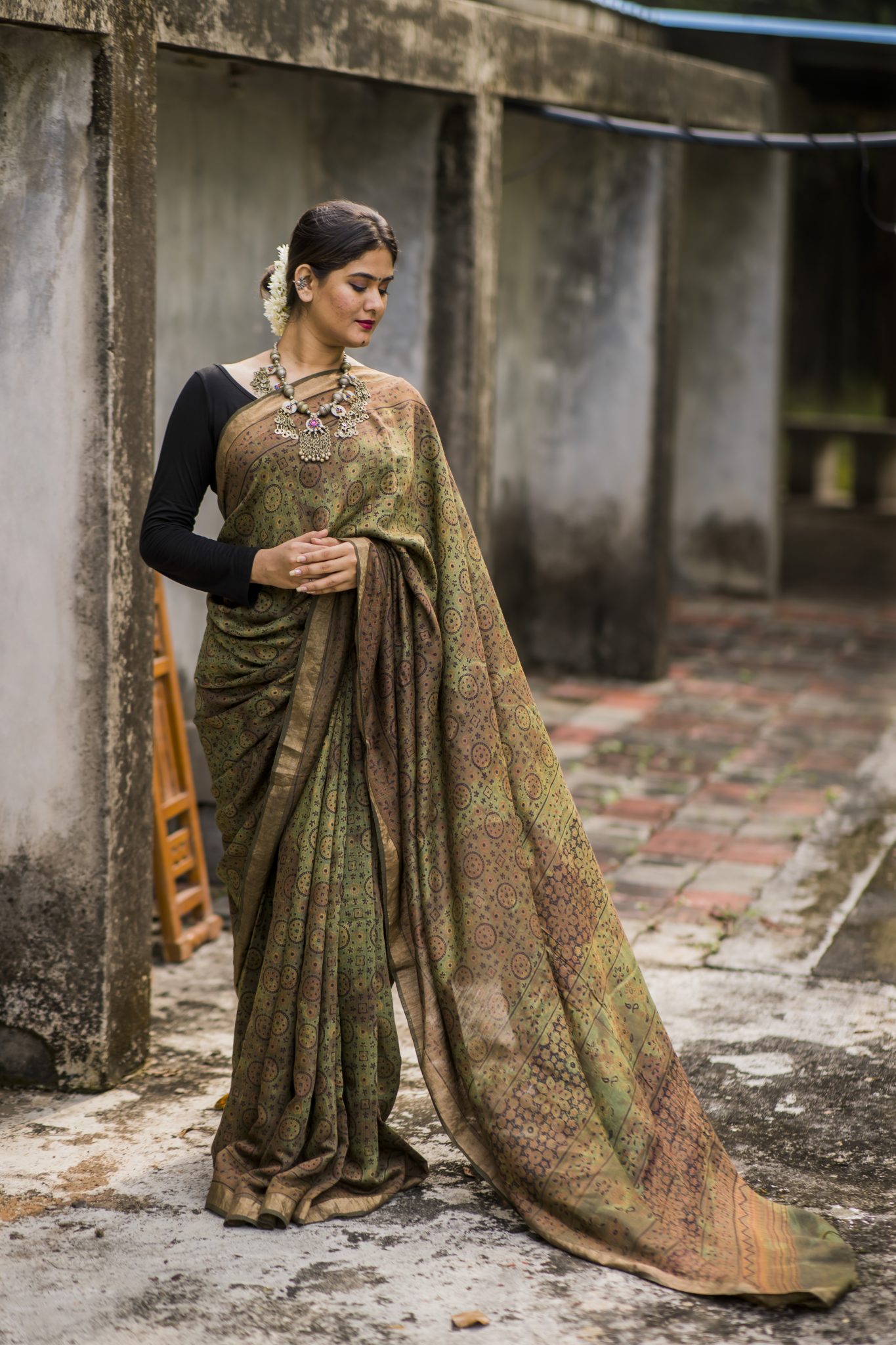 Mehendi green coloured shaded handblock printed ajrakh silk saree with golden border